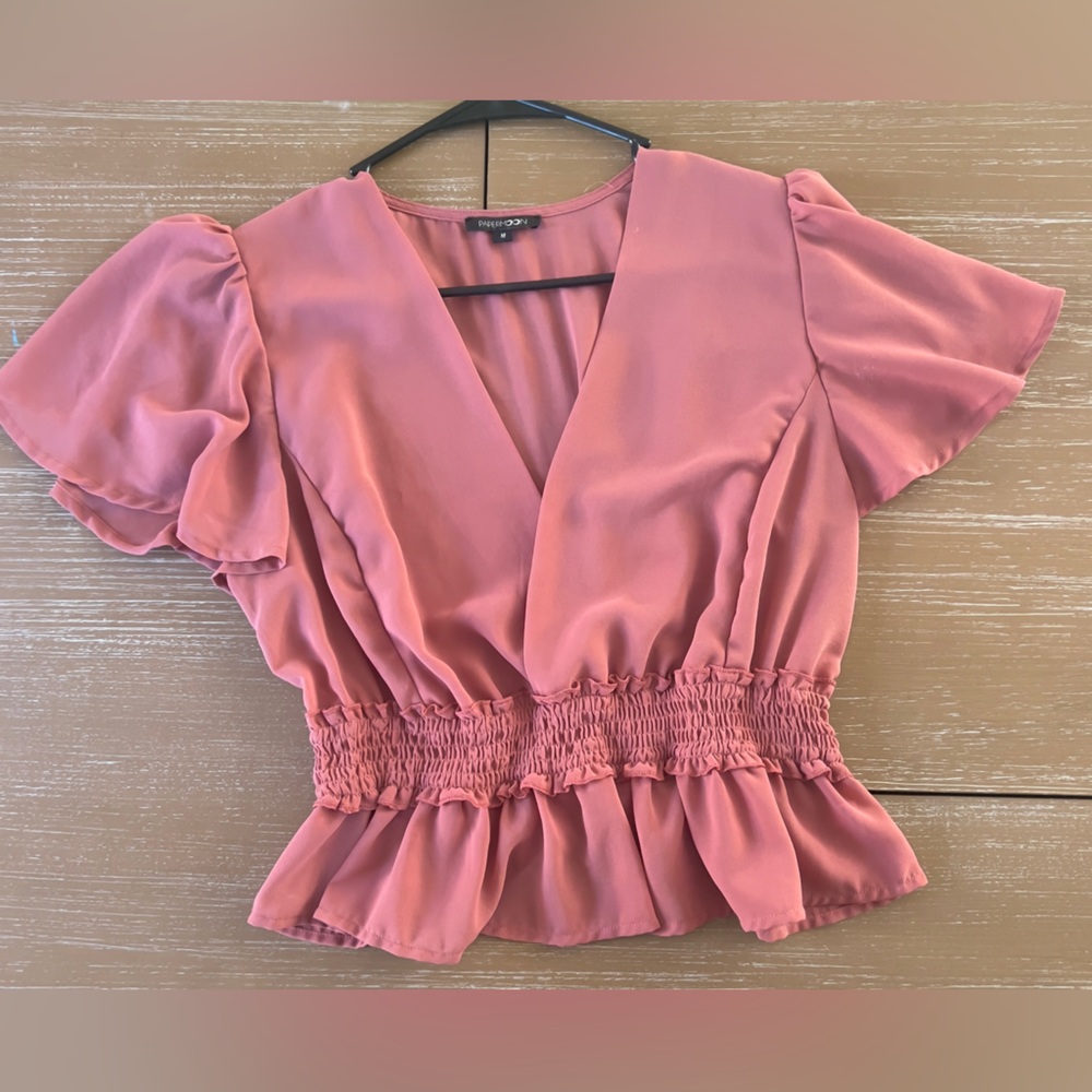 Pink ruffle low V-neck blouse